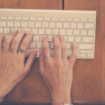 hands-woman-apple-desk